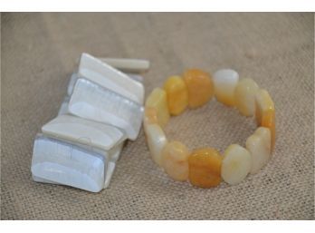 (#7) Lot Of 2 Stretch Bracelets 1-plastic White / Gray (Stretched Out) 2- Amber Glass (nice)