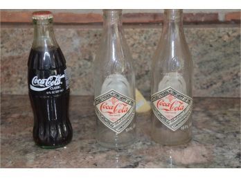 (#87) Vintage Coke Cola Empty Atlanta Authority Commemorative 10 Fl. Oz. And Atlanta 1996 Olympic Bottle Full