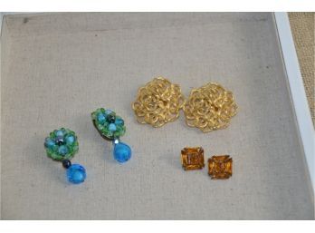 (#69) Quality 3 Clip On Earrings 1- Vintage German Green Stone 2- F.O. Inc Gold Swirl 3- Glass Amber Stone