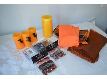 Assortment Of Halloween Napkins And Candles