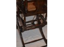(#83) Antique Primitive USA Wicker Oak Convertible Baby High Chair / Rocker / Potty Seat Cast Iron Toy Wheels