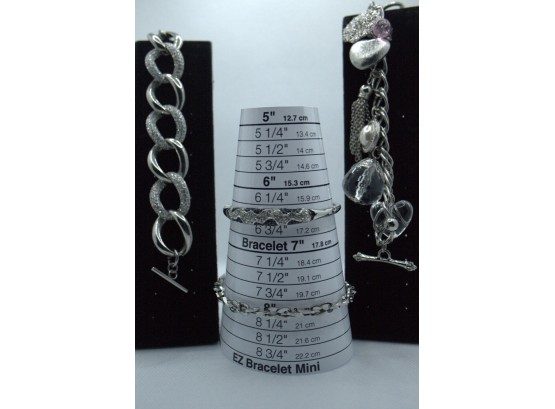 4- Silver Bracelets/ 2-  Toggle Bracelets  1-S Steel Link / 1- Silver Bangle