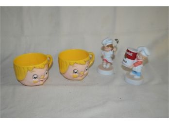 (#43) Campbell Soup Figurines (2)  And Plastic Soup Cups (2)