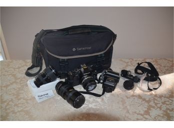 (#10) Nikon N2000 Film Camera, 52mm Lense, Tokina Lense 62mm, Flash Zykkor Carry Bag