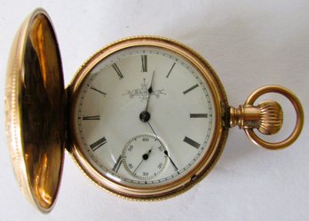 An Elgin Pocket Watch In A Finely Engraved Gold Case.