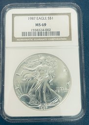1987 SILVER AMERICAN EAGLE $1 99.9 PERCENT FINE SILVER ROUND - NGC GRADED -MS69