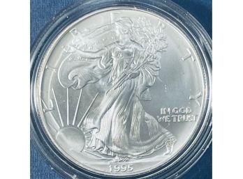 1995 UNITED STATES SILVER AMERICAN EAGLE SILVER COIN  - ONE OZT. .999 FINE SILVER ROUND - IN PLASTIC CAPSULE