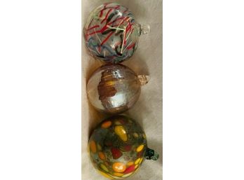3 Glass Ornaments In Various Colors