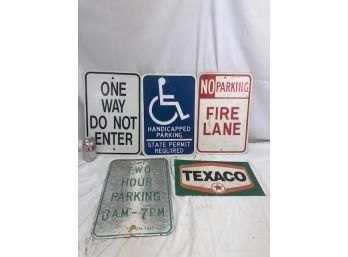 Various Street Signs And Texaco Metal Sign