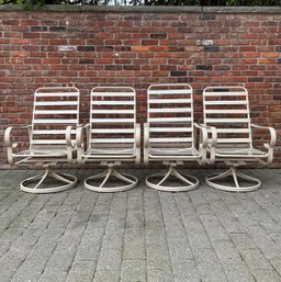 Four Outdoor Swivel-Rocker Arm Chairs