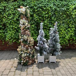 Three Artificial Christmas Trees