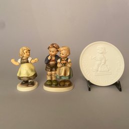 Three Hummels: Girl In Yellow Skirt, Boy And Girl With Apples, Collectors Club Medallion