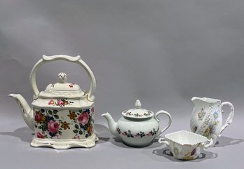 Two Tea Pots With A Unmatched Vintage Sugar Bowl And Creamer