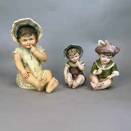 Three Bisque Piano Baby Figurines, C. 20th Century