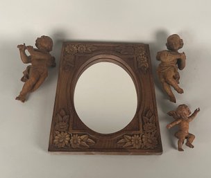 Carved Wood Angels Or Putti And A Carved Wood Frame Mirror, Modern