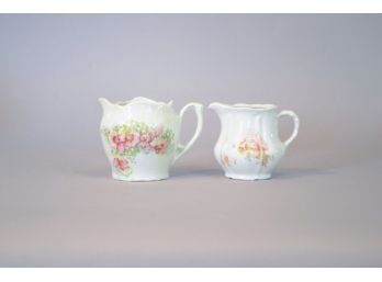 Two White Porcelain Creamers With Floral Decoration