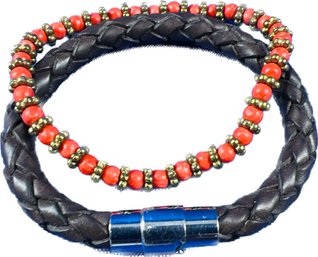 Two Contemporary Bracelets - One Woven Leather With Magnetic Closure, One Beaded With Stretch Material