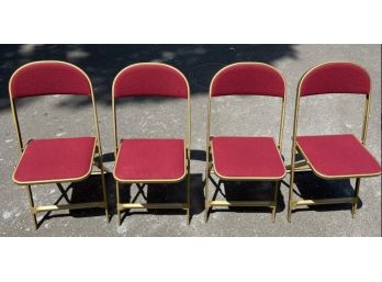 Four Metal Folding Chairs With Pinstripe Covers