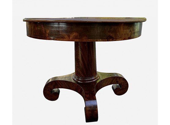 American Empire Period - Flame Mahogany Single Column Library Table Ending In Four Scrolled Legs