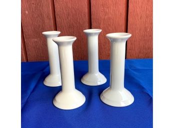 Four White Porcelain Candlesticks