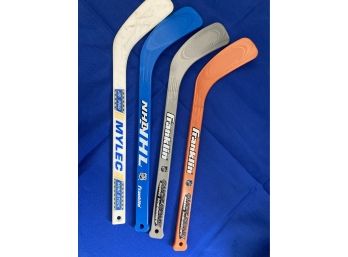 Four Mini Hockey Sticks