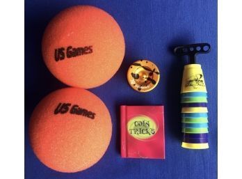 Two Nerf Balls, Popstar Yoyo, Speed Stacks Toy, & Mini Coin Tricks Book