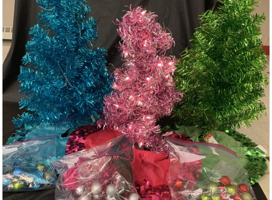 Three Lighted Tinsel Trees With Ornaments