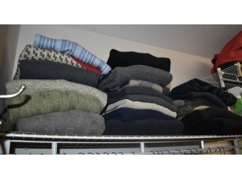 Shelf Of Sweaters And Jeans