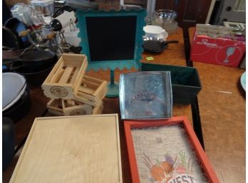 Assortment Of Boxes And Chalkboard Stand.