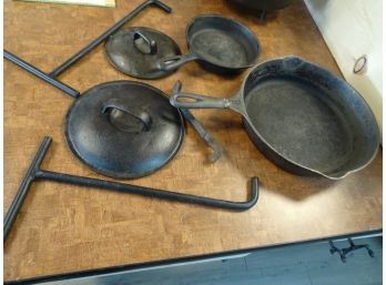 #8 Wagner Skillet, #3 Skillet, Stove Lid Lifter, 2 Pot Lifters And 2 Lids.