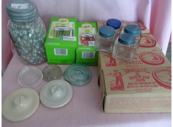 Ball Jar Of Clear Marbles, Lids, Boxes Of Lids And 4 Square Jars.