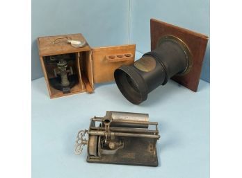A Cased Microscope, An Enlarger Lense And Works To An Edison Player