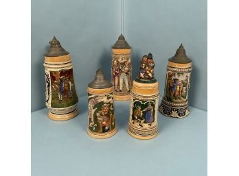 Three German 1/2L Steins Together With Two Others.