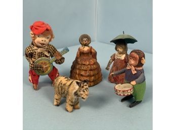 Schuco Monkey Toy, A Banjo Playing Monkey, A Miniature Tiger, White Metal Girl With Umbrella And Doorstop