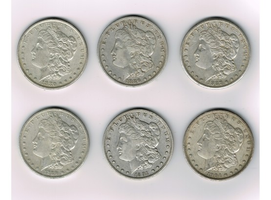 Six Morgan Silver Dollars
