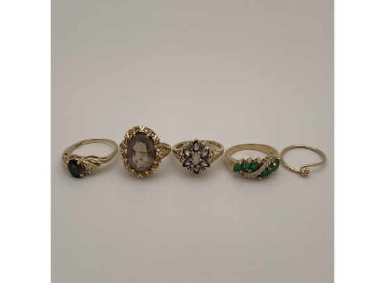 Four Ladies Gem-Set Gold Rings And A Tension Band