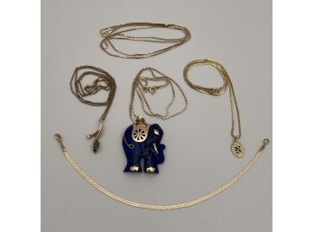 Four Ladies 14k Yellow Gold Necklaces And A Bracelet.