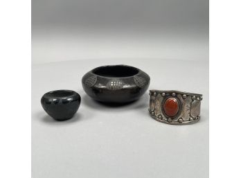 Navajo Sterling Silver Coral-Mounted Cuff Bracelet And Two Black Carved Pottery Bowls, Twentieth Century