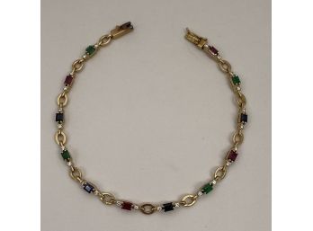 Ladies 14k Yellow Gold Diamond, Ruby, Emerald And Sapphire Set Tennis Bracelet.