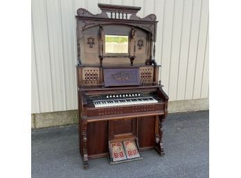 American Carved Walnut Pump Organ, The Bridgeport Organ Co., Bridgeport, Connecticut, Circa 1890