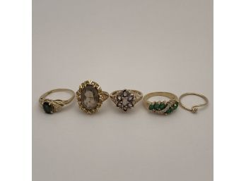 Four Ladies Gem-Set Gold Rings And A Tension Band
