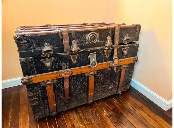 Sold at Auction: A large antique steamer trunk