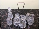 (C-36) LOT OF TWO - ANTIQUE GLASS CASTOR SETS  WITH STANDS - 4 MATCHING BOTTLES EACH - 10' TALL
