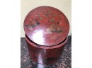 (X47) ANTIQUE CHINESE PAPER MACHE  ROUND STORAGE BOX - OXBLOOD RED WITH DECORATION - 14' ACROSS
