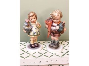 (A-39) LOT OF 2  VINTAGE HUMMEL FIGURINES - BOY W/BACKPACK & GIRL W/FLOWERS - ALL UNDAMAGED - 4-5' TALL
