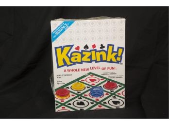 (B5) 'KAZINK!' GAME IN ENGLISH AND SPANISH-AGES 7 THRU ADULTS-NEVER OPENED