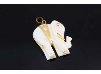 (E1) 14 KT GOLD AND BONE IVORY ELEPHANT PENDENT-WEIGHT APPROX. 1.7 DWT-1'X 3/4'