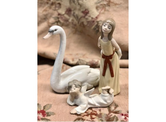LOT OF THREE LLADRO FIGURINES - SWAN - GIRL WITH HAT & BABY ANGEL