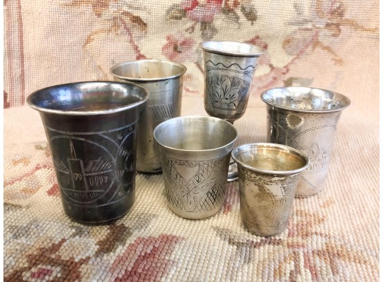 6 PIECE STERLING SILVER KIDDISH CUPS. BETWEEN 2 AND 3 INCHES TALL.