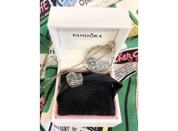 LOT OF 2 PANDORA PIECES. CRUISE SHIP CHARM AND NECKLACE WFLOATING HEARTS. NECKLACE IS 30' CHAIN AND 1 ' ACROS